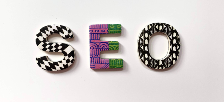 the letters SEO, each in a different pattern and color