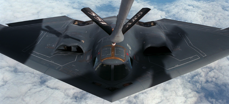 stealth bomber lining up for mid-air refueling