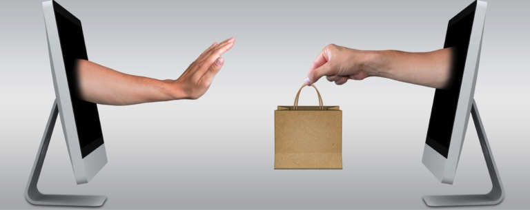 two screens facing each other with arms coming out of them. One is holding a shopping bag.