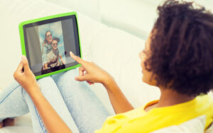 African-American woman watching video on a tablet