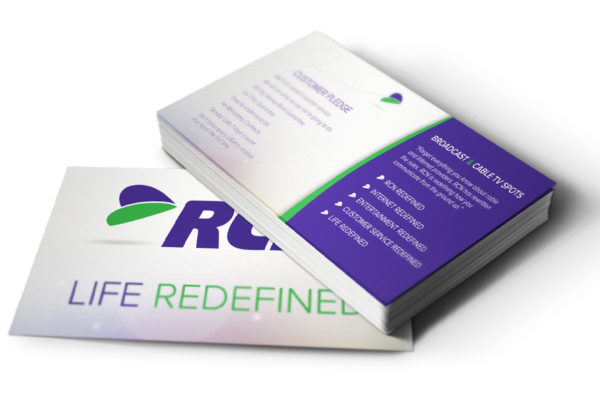 a stack of RCN business cards with the words life redefined