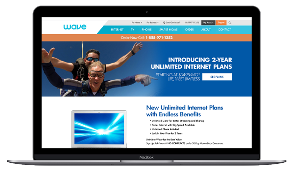 skydivers and the words -- introducing 2-year unlimited internet plans -- on a laptop screen